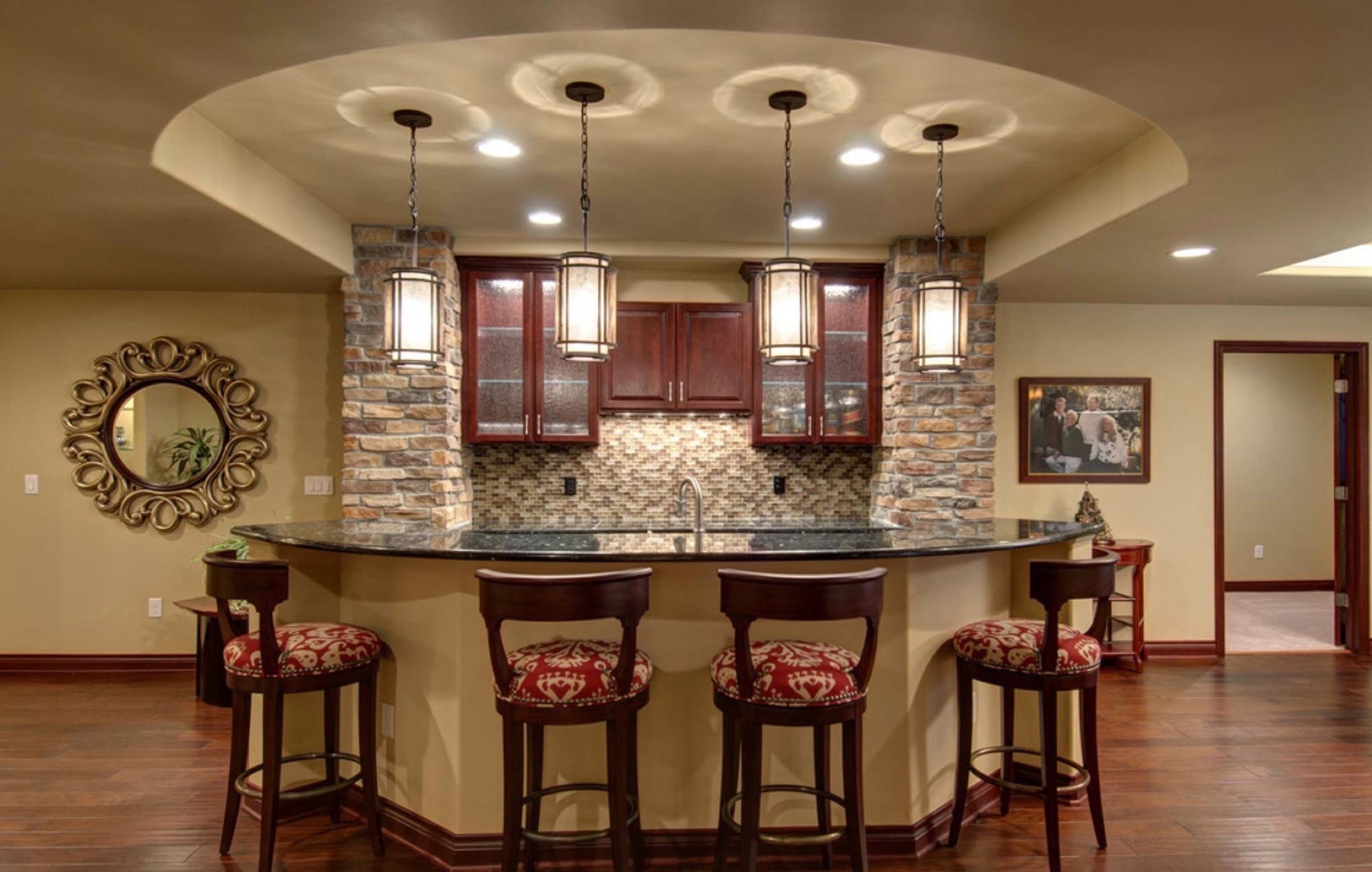 Fully functional basement mini-kitchen with tray ceiling and island seating area. Beautiful and perfect for drinks and conversation with guests!