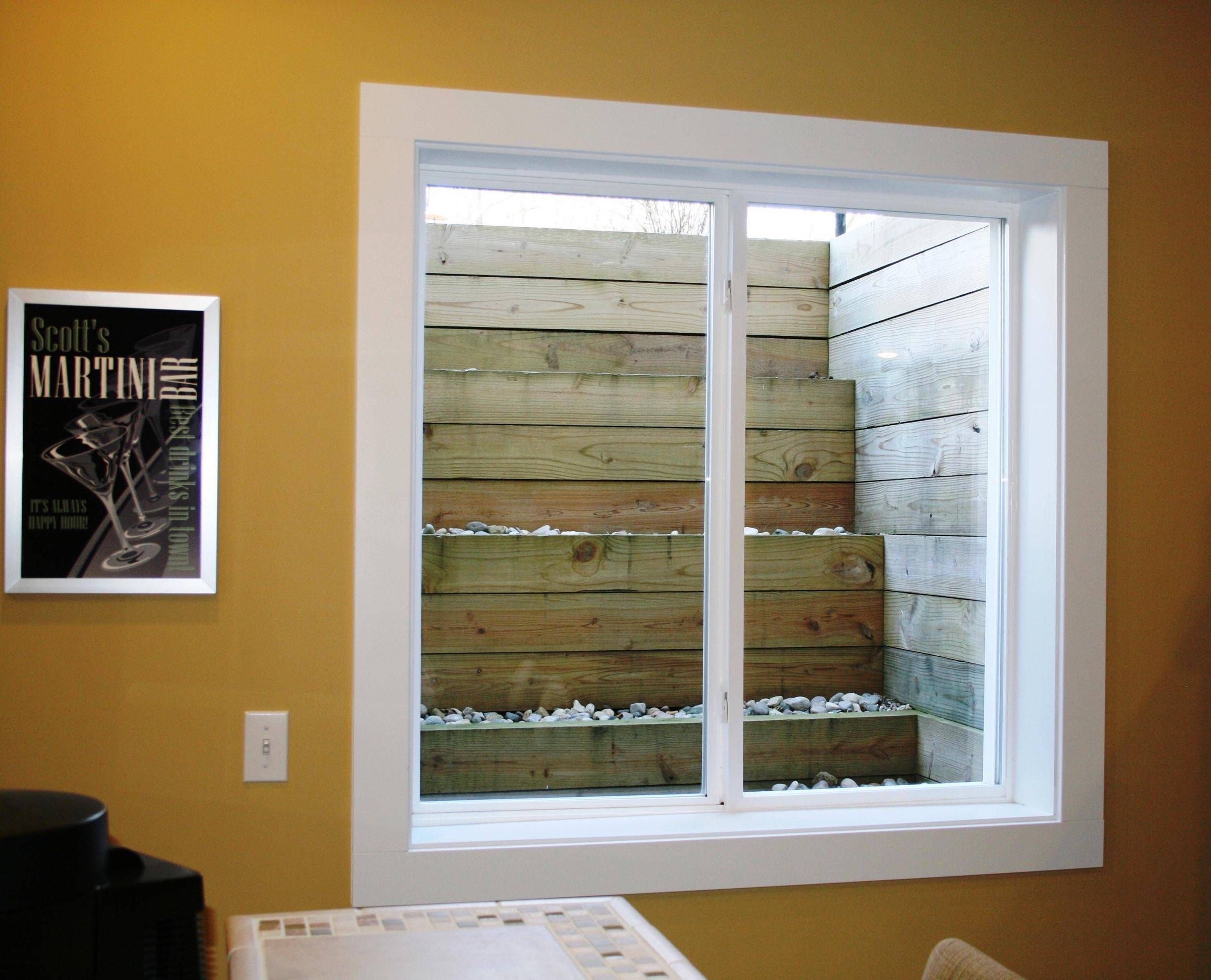 Egress window with cleverly engineered decorative steps for easy access