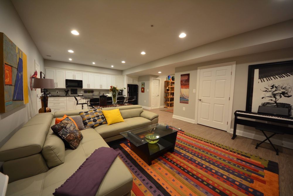 While this isn’t exactly a small basement, a rug in the center of the room helps tie things together and makes the room appear larger