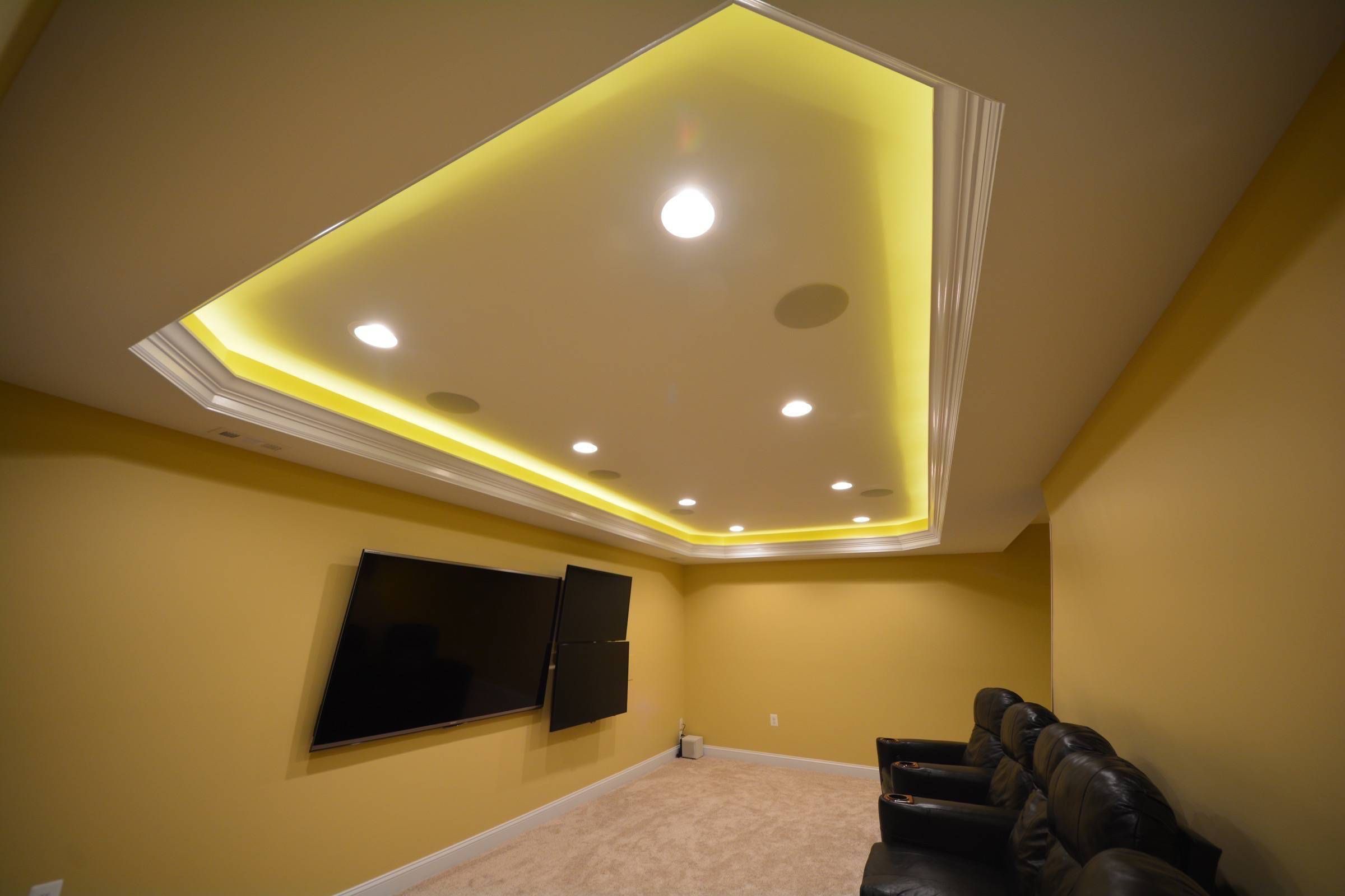 Entertainment Center with tray ceiling and hidden LED lighting for atmosphere.