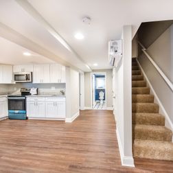 Basement Remodeling - LVT With Kitchenette and White Interior