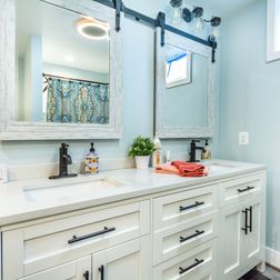 Basement Light Blue Bathroom with White Vanity