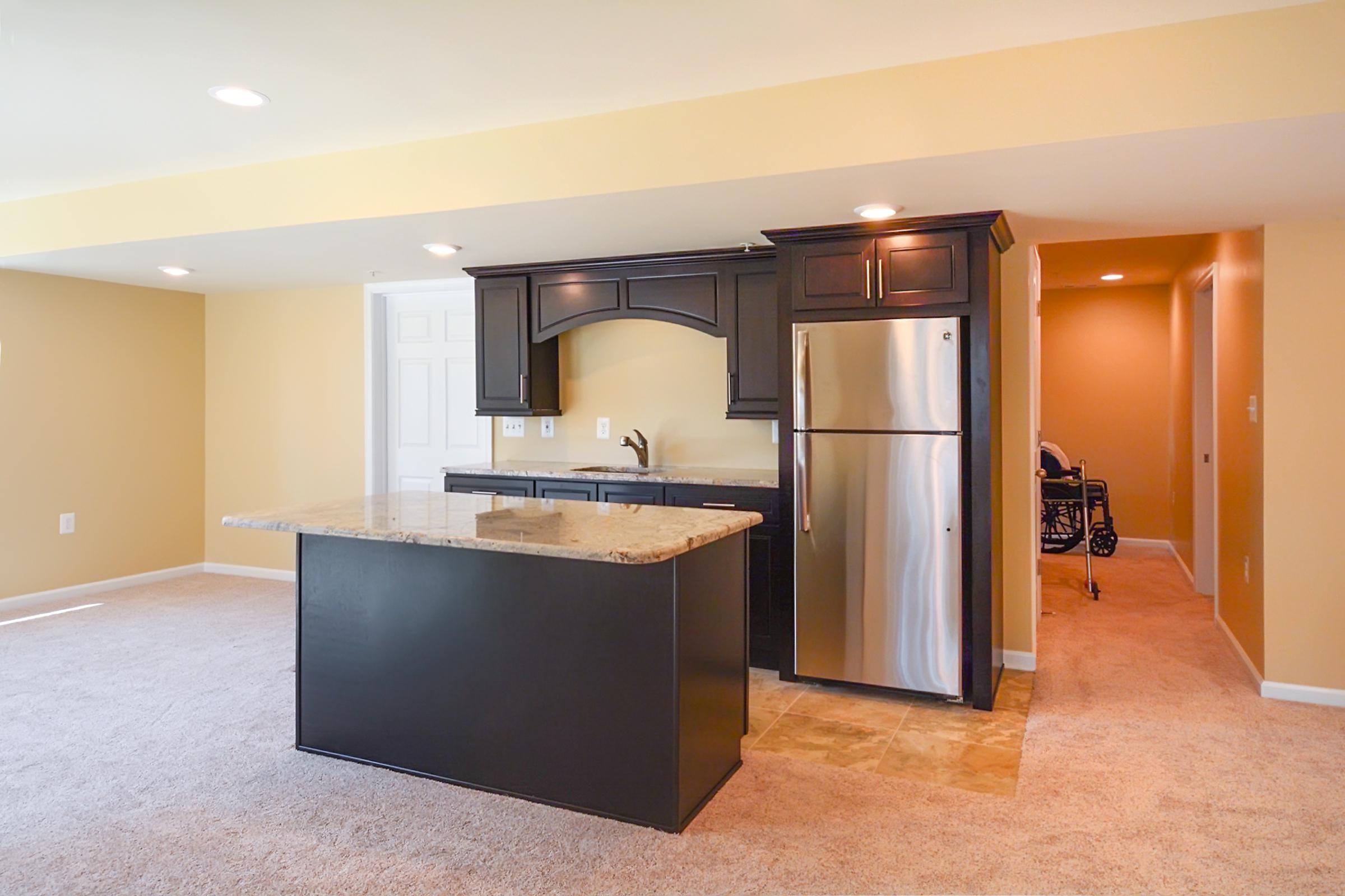 Accessible Basement Remodel - Mosaic Tile Flooring and Marble Countertops 