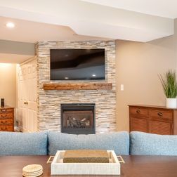 Basement remodel with a cozy family room and wet bar, Kensington, MD