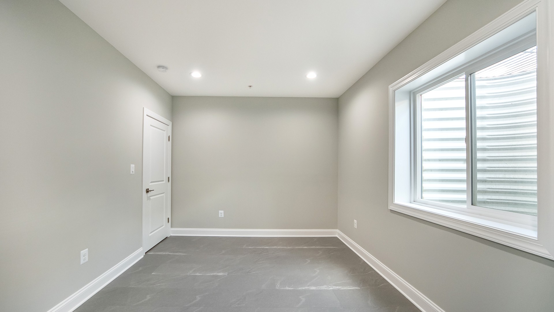 Spacious basement finishing with wet-bar and full bathroom