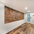 Finished Basement with a kitchen and exposed brick walls., Washington, DC