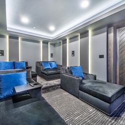 A complex basement finishing with movie theater, beautiful wet-bar/dry-bar and pool table area