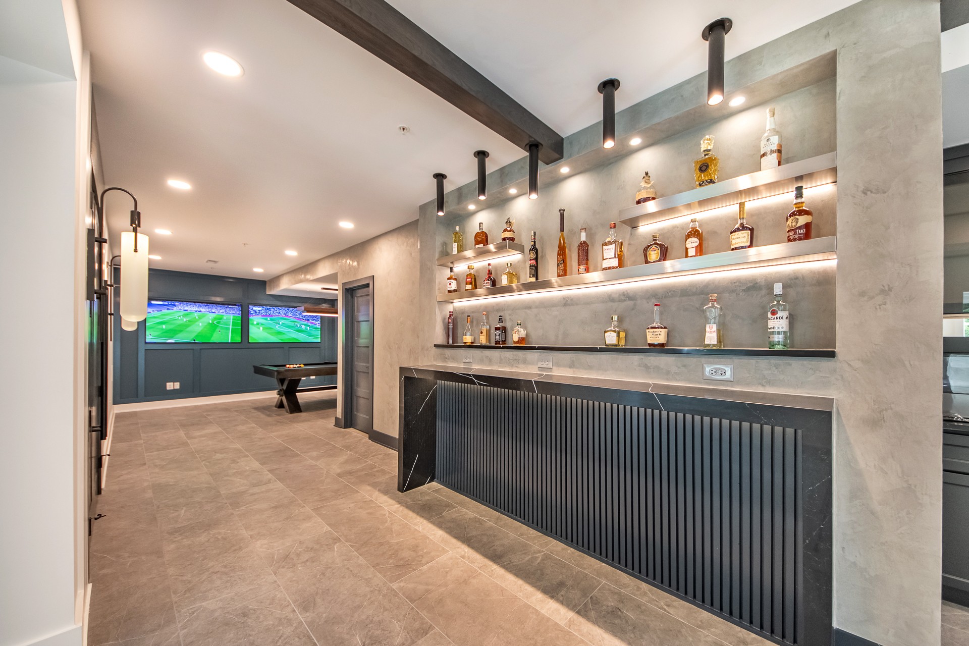 A complex basement finishing with movie theater, beautiful wet-bar/dry-bar and pool table area