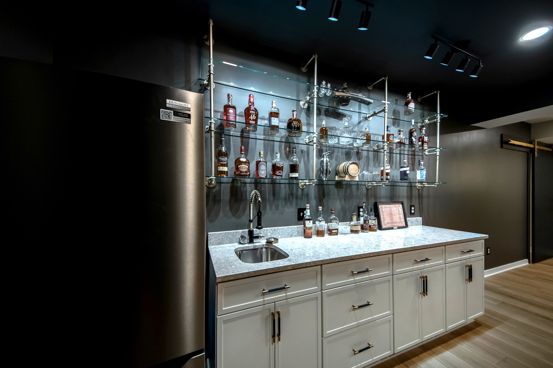 Stylish Basement Remodel with Wet Bar, Gym, and Lounge