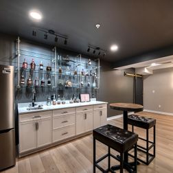 Stylish Basement Remodel with Wet Bar, Gym, and Lounge