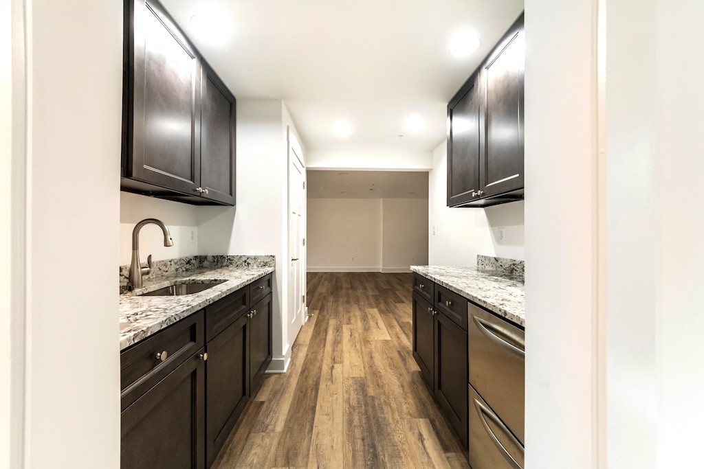 Sophisticated Basement Remodel with Marble and Wood Accents