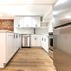 Chic Industrial Basement with Exposed Brick and Contemporary Kitchen