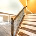 Modern Basement Design with Custom Wet Bar and Elegant Finishes