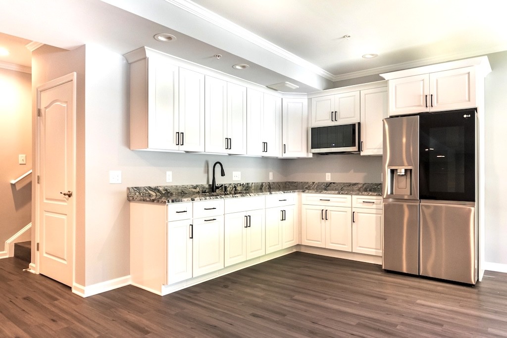 Elegant Basement Remodel with Granite Wet Bar and Luxurious Bathroom 