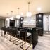 Sophisticated Basement Remodel with Stylish Wet Bar and Open Layout 