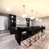 Sophisticated Basement Remodel with Stylish Wet Bar and Open Layout 