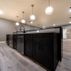 Sophisticated Basement Remodel with Stylish Wet Bar and Open Layout 