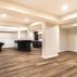 Stylish Basement Renovation with Custom Bar and Designer Bathroom