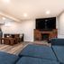 Stylish Basement Remodel with Cozy Entertainment Area and Rustic Wet Bar