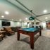 Spacious Basement Remodel with Modern Wet Bar and Entertainment Area 