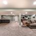 Spacious Basement Remodel with Modern Wet Bar and Entertainment Area 