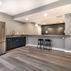 Stylish Basement Transformation with Wet Bar and Multi-Purpose Layout