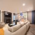 Sophisticated basement retreat with a marble-topped bar and a moody stone fireplace in Lutherville, MD, Lutherville, MD