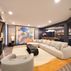 Sophisticated basement retreat with a marble-topped bar and a moody stone fireplace in Lutherville, MD, Lutherville, MD