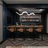 Sophisticated basement retreat with a marble-topped bar and a moody stone fireplace in Lutherville, MD, Lutherville, MD
