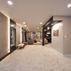 Sophisticated basement retreat with a marble-topped bar and a moody stone fireplace in Lutherville, MD, Lutherville, MD