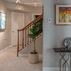 Sophisticated basement retreat with a marble-topped bar and a moody stone fireplace in Lutherville, MD, Lutherville, MD