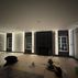 Sophisticated basement retreat with a marble-topped bar and a moody stone fireplace in Lutherville, MD