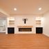 A 1,336 sq. ft. basement renovation with a stacked-stone fireplace, custom wet bar, and private suite, Fairfax, VA