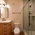 A 1,336 sq. ft. basement renovation with a stacked-stone fireplace, custom wet bar, and private suite, Fairfax, VA