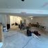 A 1,336 sq. ft. basement renovation with a stacked-stone fireplace, custom wet bar, and private suite, Fairfax, VA