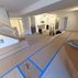 A 1,336 sq. ft. basement renovation with a stacked-stone fireplace, custom wet bar, and private suite, Fairfax, VA