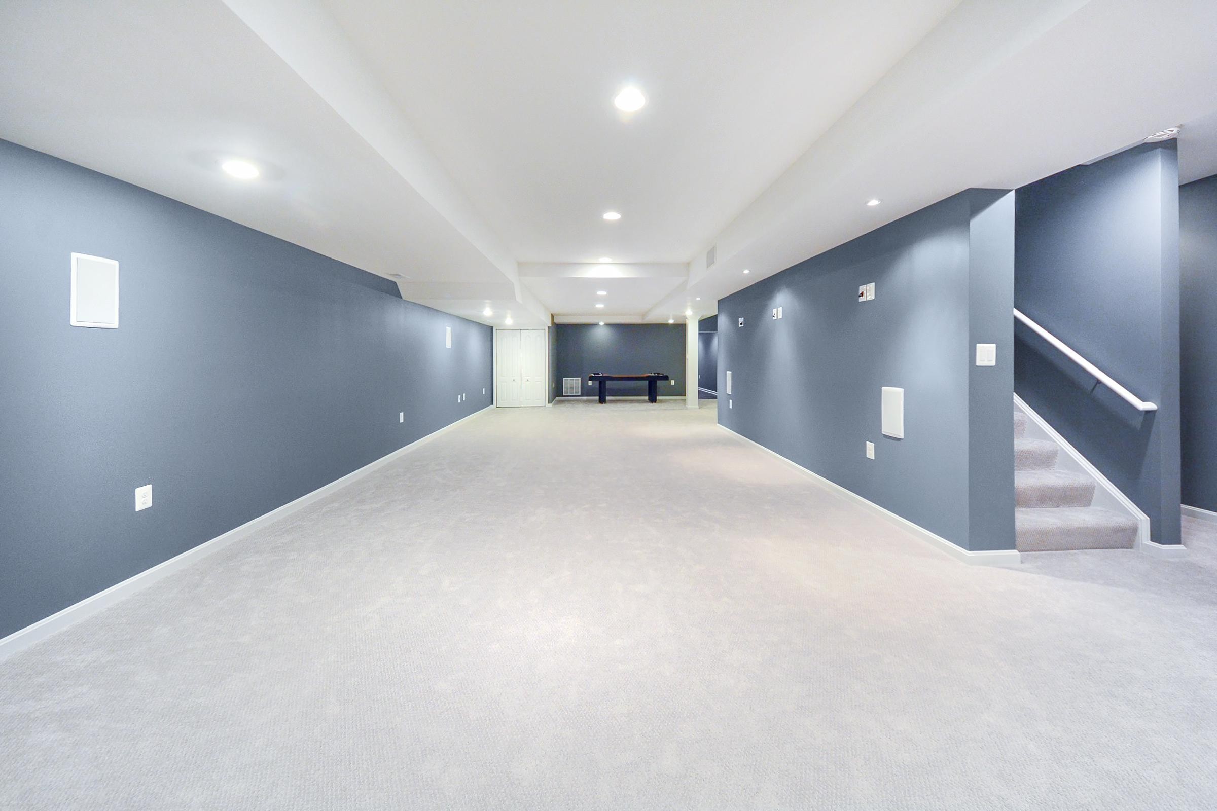 Sleek Basement Design Recessed Ceiling, LVT Planking
