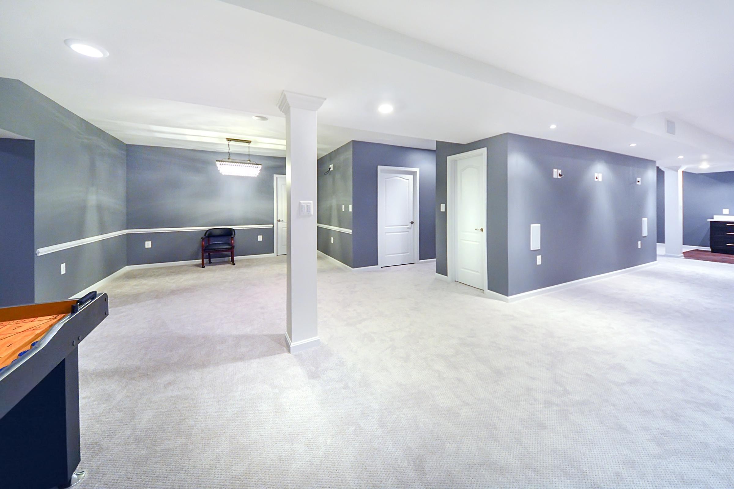 Sleek Basement Design Recessed Ceiling, LVT Planking